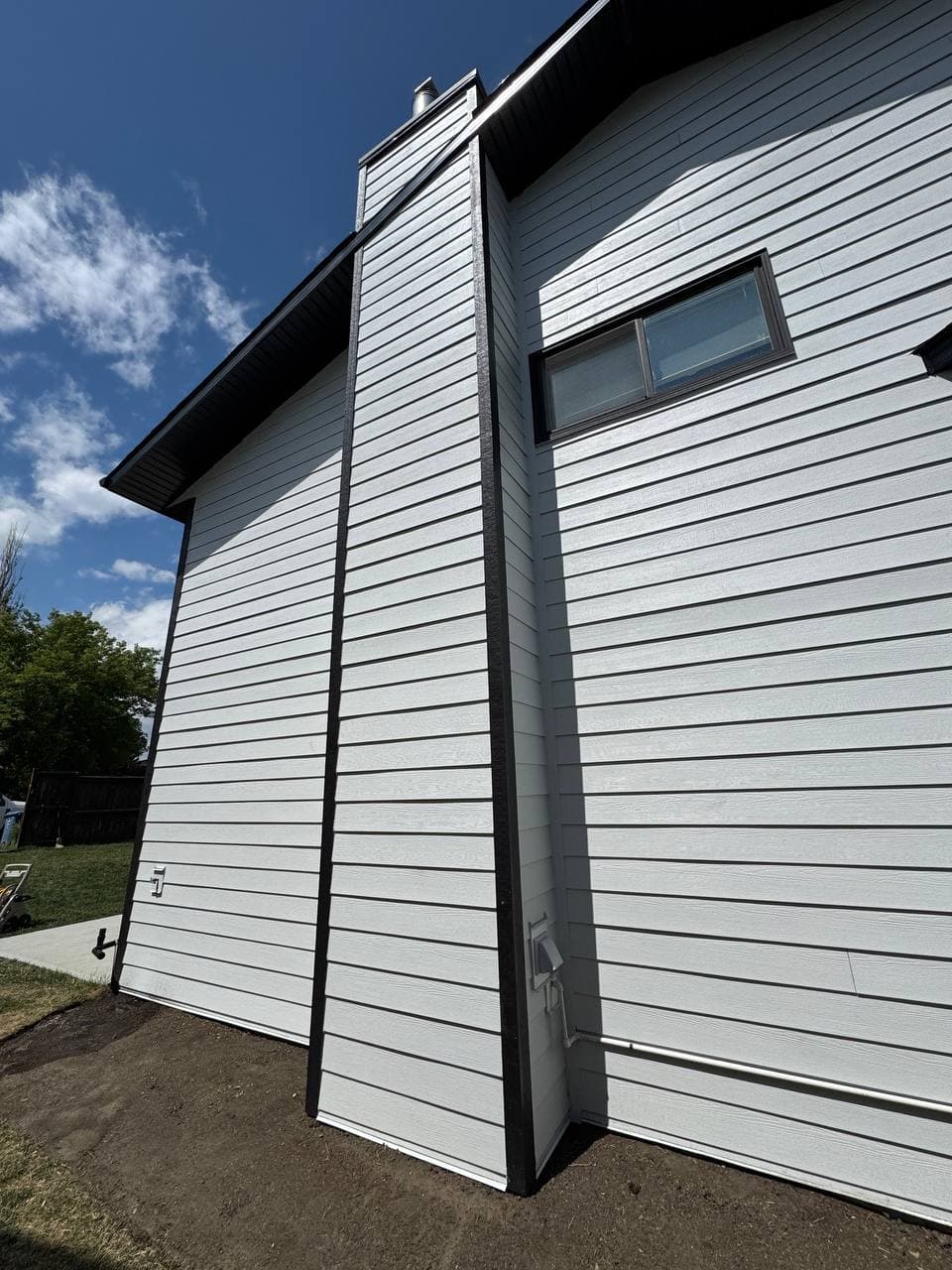 Full exterior renovation replacing outdated vinyl siding with durable Hardie board. The upgrade enhances curb appeal while significantly improving protection and long-term performance.