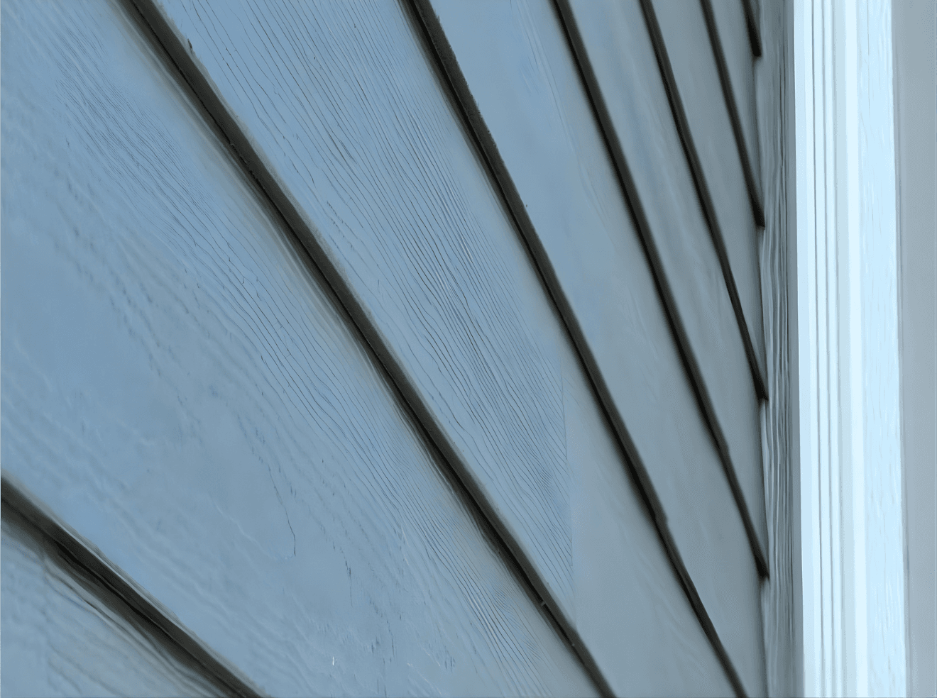 Ground-up exterior installation featuring a contemporary mix of Hardie panels, board and batten accents, and complementary materials. Designed for a clean, modern look with long-term durability and weather resistance.