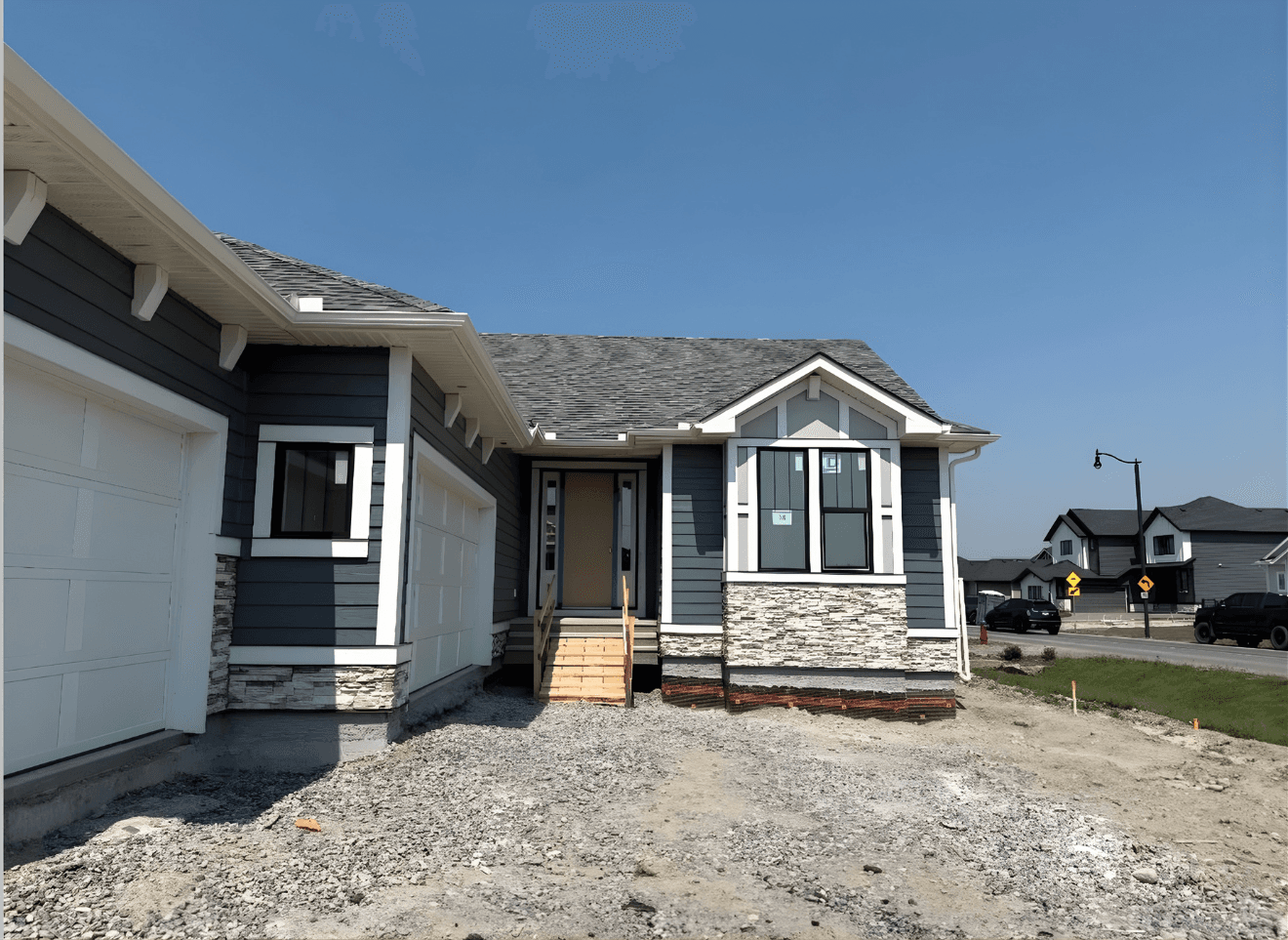 Ground-up exterior installation featuring a contemporary mix of Hardie panels, board and batten accents, and complementary materials. Designed for a clean, modern look with long-term durability and weather resistance.