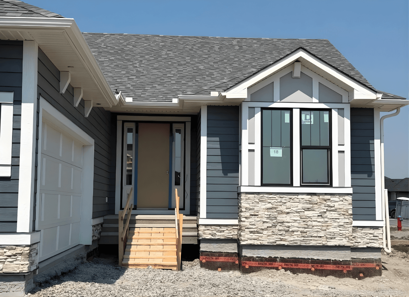 Ground-up exterior installation featuring a contemporary mix of Hardie panels, board and batten accents, and complementary materials. Designed for a clean, modern look with long-term durability and weather resistance.