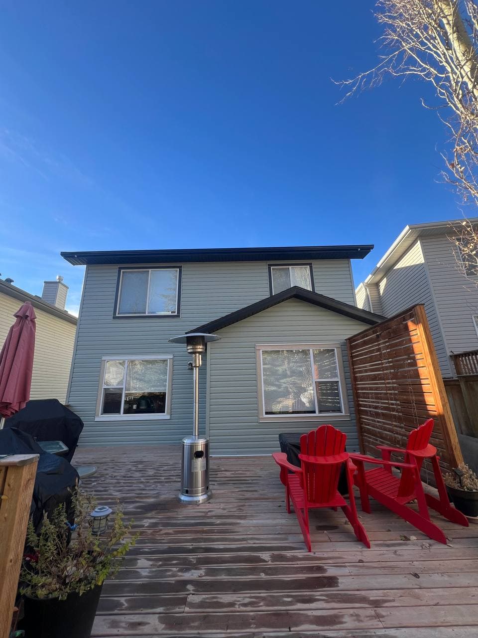 Old vinyl removal and renovation project with new vinyl installation and board-and-batten accent details. The work includes removing the old siding, preparing the surface, and adding clean, modern finishes to improve the look of the house.