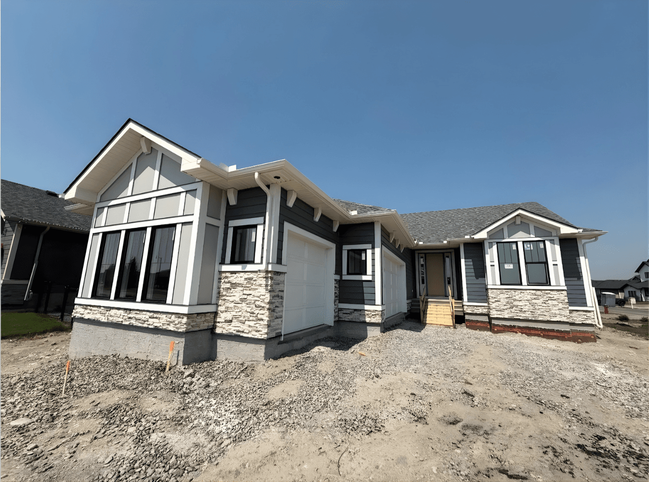 Ground-up exterior installation featuring a contemporary mix of Hardie panels, board and batten accents, and complementary materials. Designed for a clean, modern look with long-term durability and weather resistance.